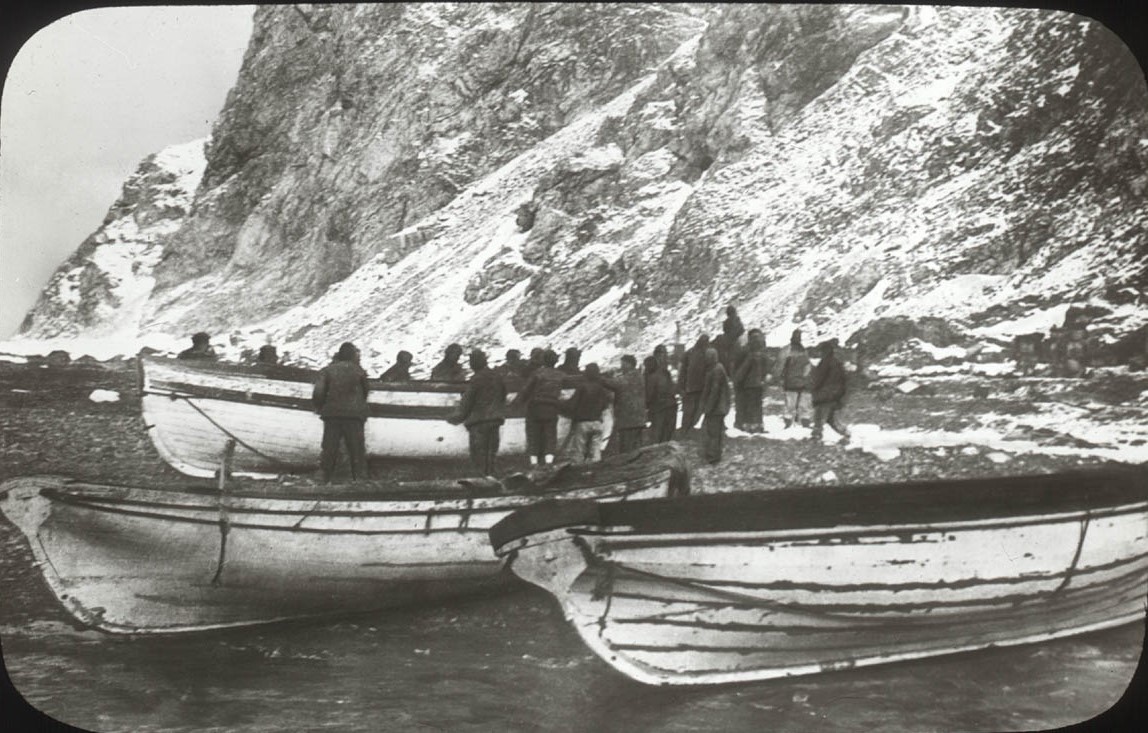 The lifeboats and crew on a beach on Elephant Island.